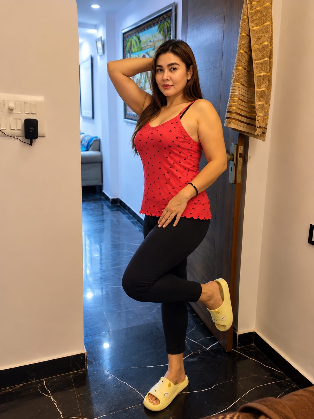Zarina portrait indoors in a red top